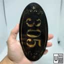 305 oval acrylic house number plate — black & gold variant
